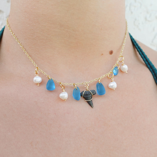 fossil tooth and glass charm necklace