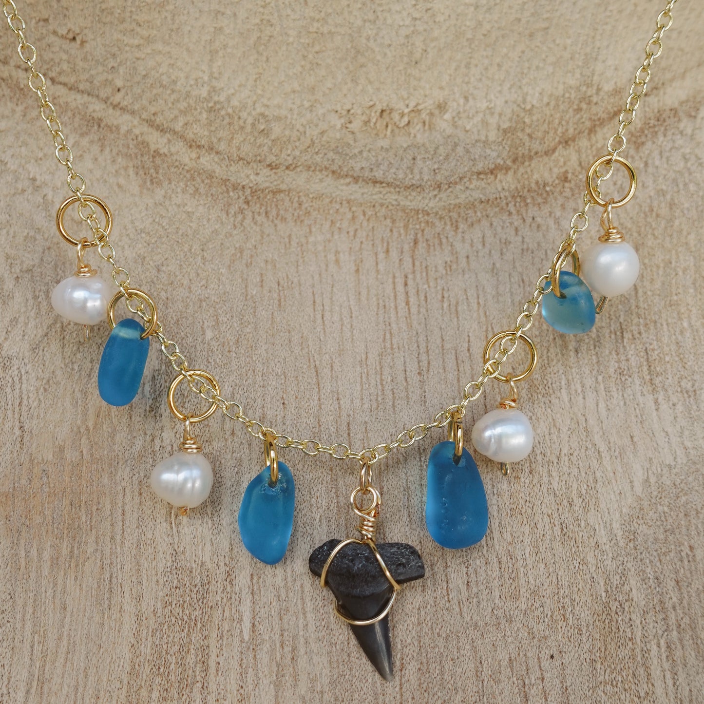 fossil tooth and glass charm necklace
