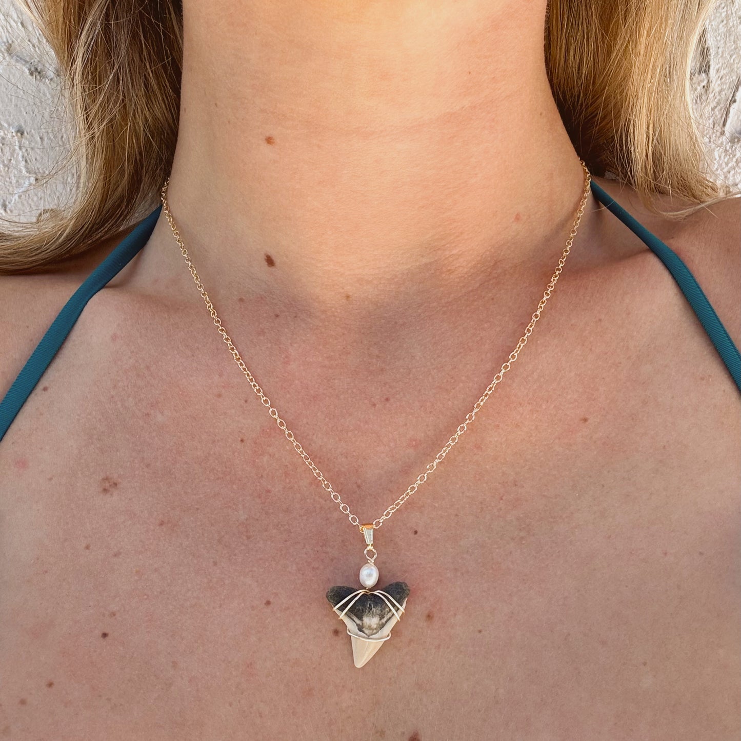 bullshark and pearl necklace